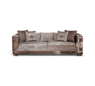 Elegant Mimosa Chester sofa featuring a metallic taupe velvet finish, decorative gold accents on the wooden frame, and five coordinating throw pillows in neutral and dark tones.