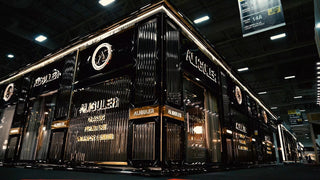 Aliguler luxury furniture exhibition booth with black and gold design showcasing classic furniture and interior design at a trade show.