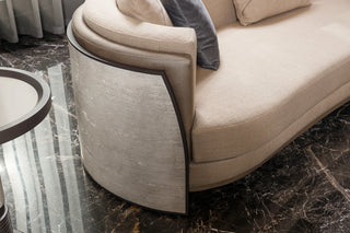 Close-up of the Tivoli Curved Sofa travertine-finish side panel