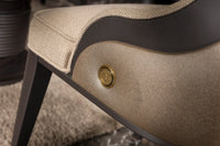 Close-up of the Tivoli dining chair brass-tone medallion