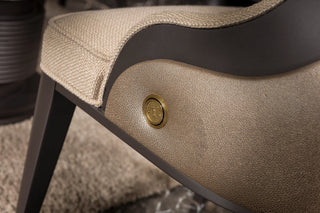 Close-up of the Tivoli dining chair brass-tone medallion